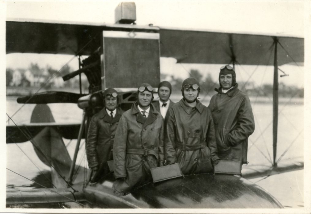 Pilot Albert Whitted (third from left, in the back row) with unidentified passengers aboard the Falcon seaplane, circa 1920