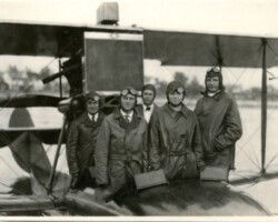 Pilot Albert Whitted (third from left, in the back row) with unidentified passengers aboard the Falcon seaplane, c. 1920 to 1923.